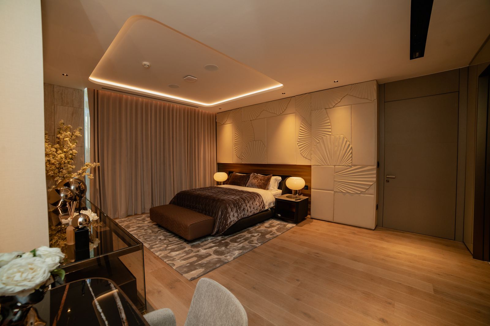 Warm-toned guest suite with layered lighting