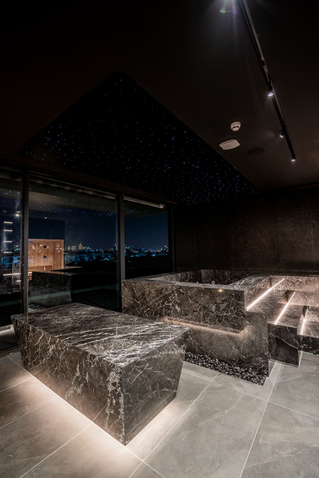 Nighttime spa illuminated with hidden lighting